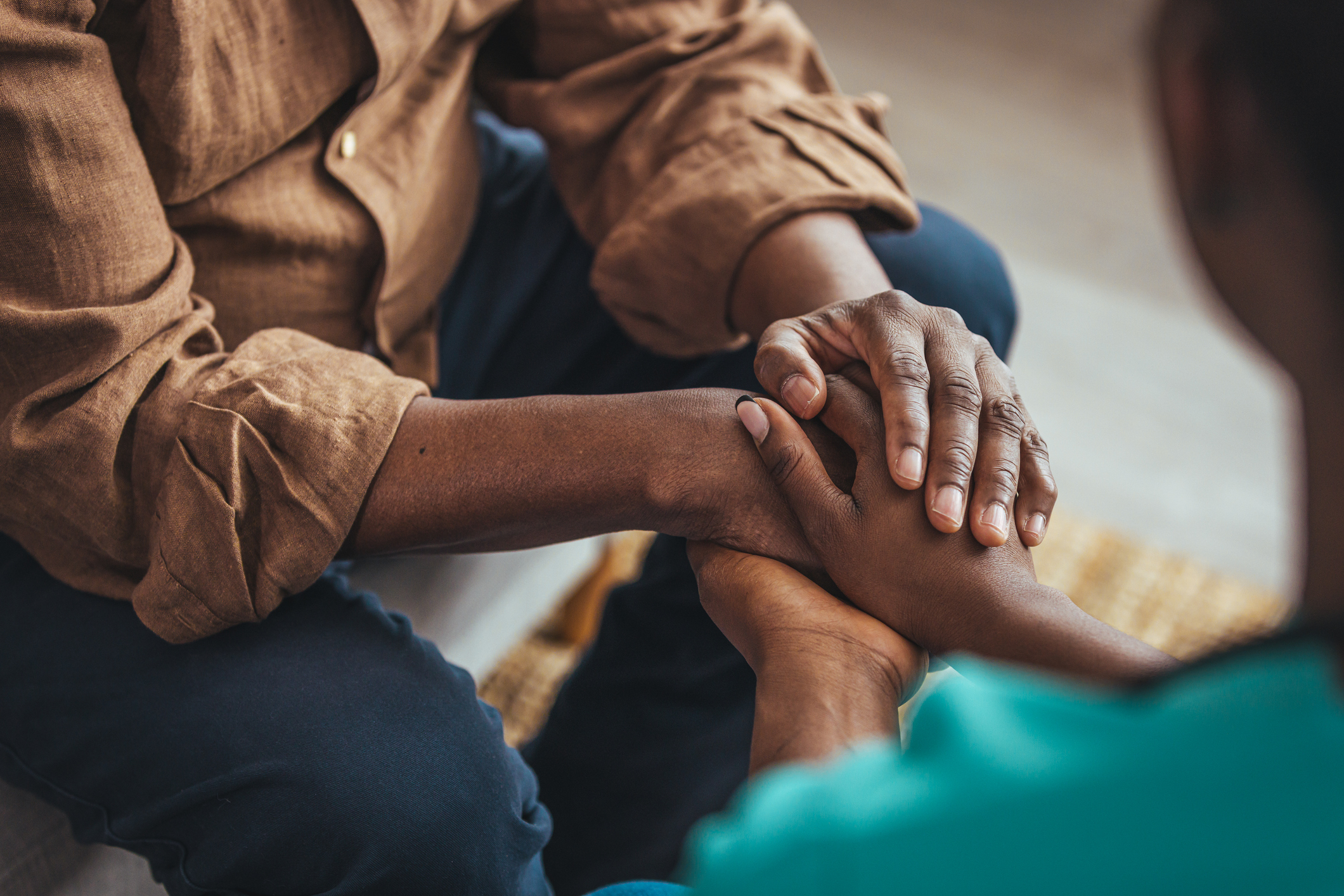 Disability Support Services ( Man consoles man in wheelchair )